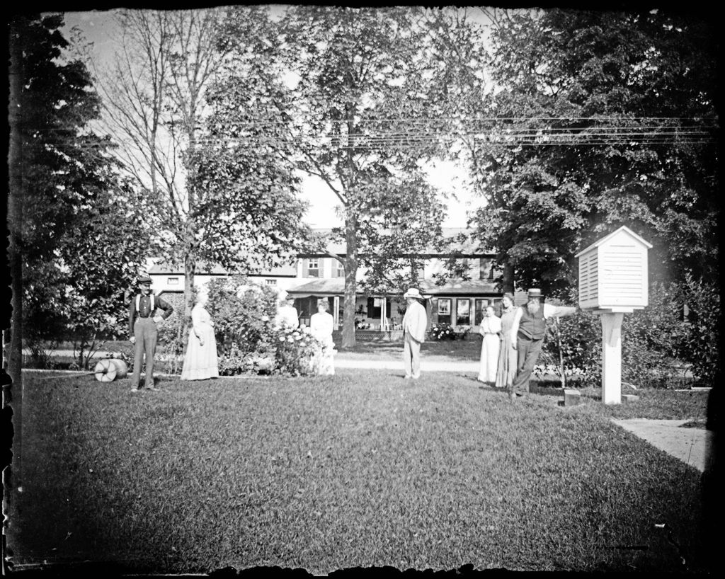 Miniature of Group Of People On The Lawn Of A Resort Hotel
