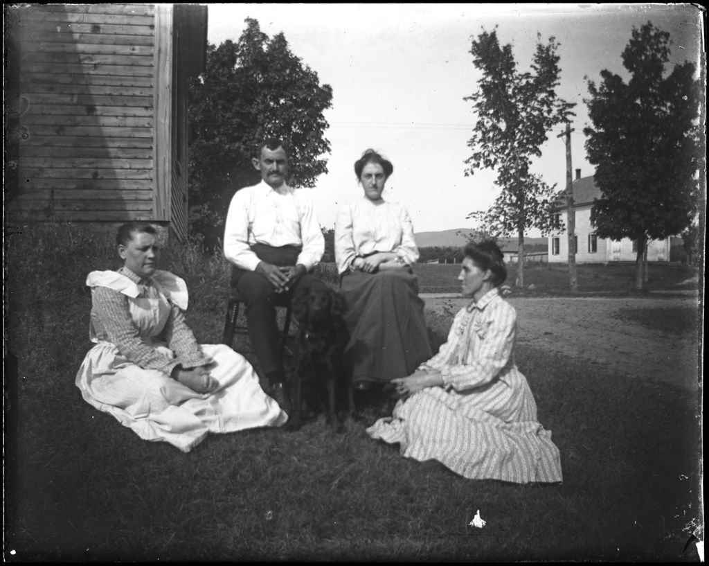 Miniature of Family Group With Dog Seated On Lawn Outside Of A House