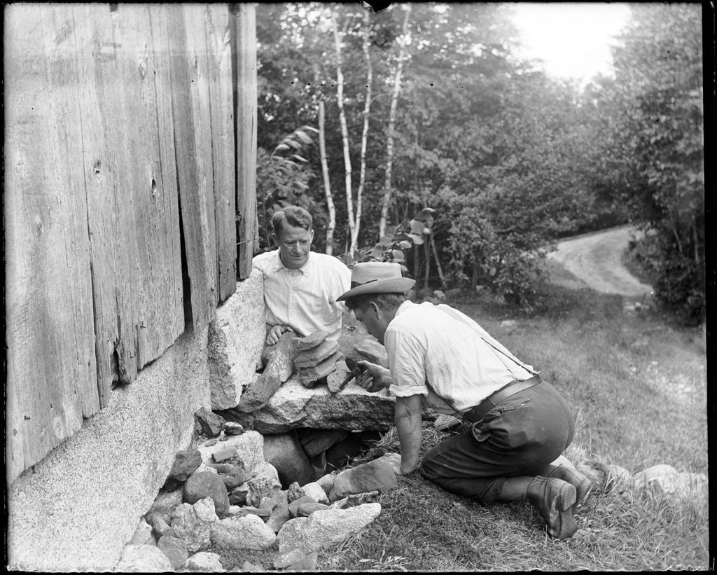 Miniature of Two Men Examining A Hole In The Stone Foundation Of An Old Barn