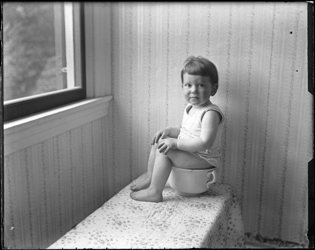 Miniature of Young Boy Sitting On A Chamber Pot