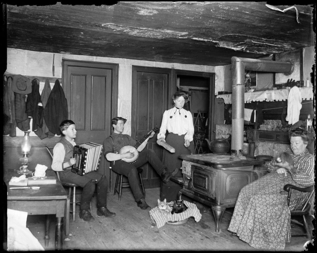 Miniature of George French And Family Sitting In The Kitchen Playing Music