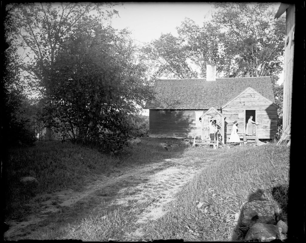 Miniature of People Outside A Small Barn