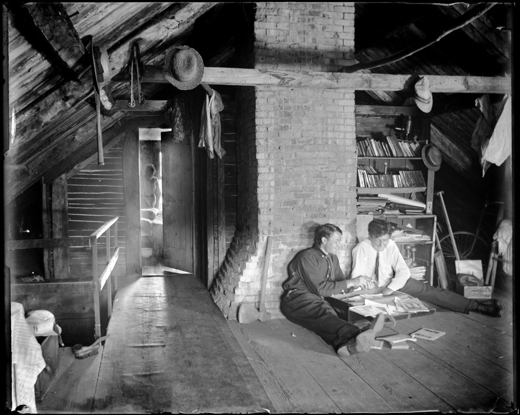 Miniature of Two Young Men In An Attic Looking Through Memorabilia