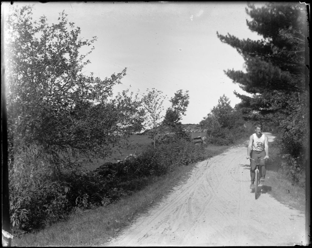 Miniature of George French Riding A Bicycle On A Rural Road