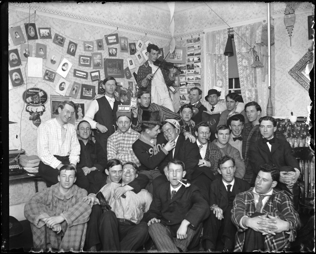Miniature of Large Group Of College Students Gather In A Dorm Room