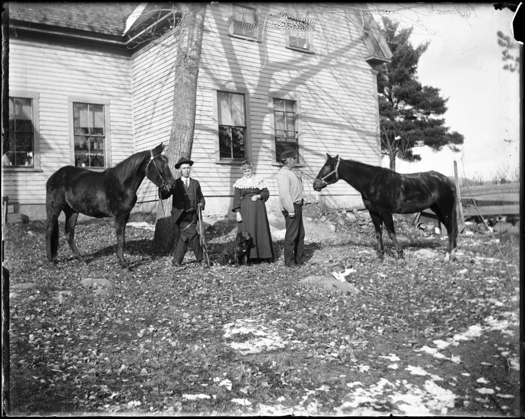 Miniature of Two Men And A Woman With Two Horses And A Dog Outside Of A Home