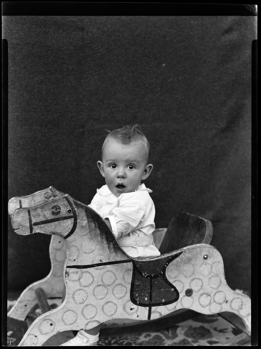 Miniature of Potrait Of A Baby In A Rocking Horse Chair