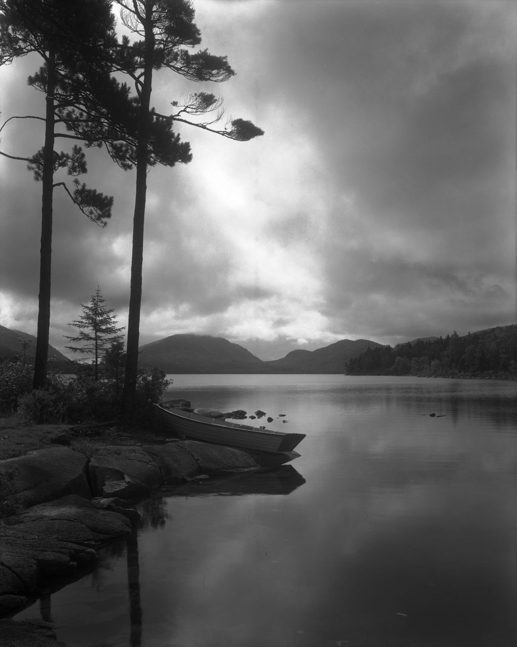 Miniature of Rowboat Pulled Up On Shore Of Eagle Lake, Late Evening Clouds And Sun Reflected In Water