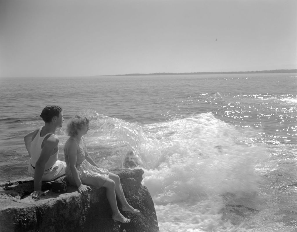 Miniature of A Couple Sitting On The Rocks At The Beach--york