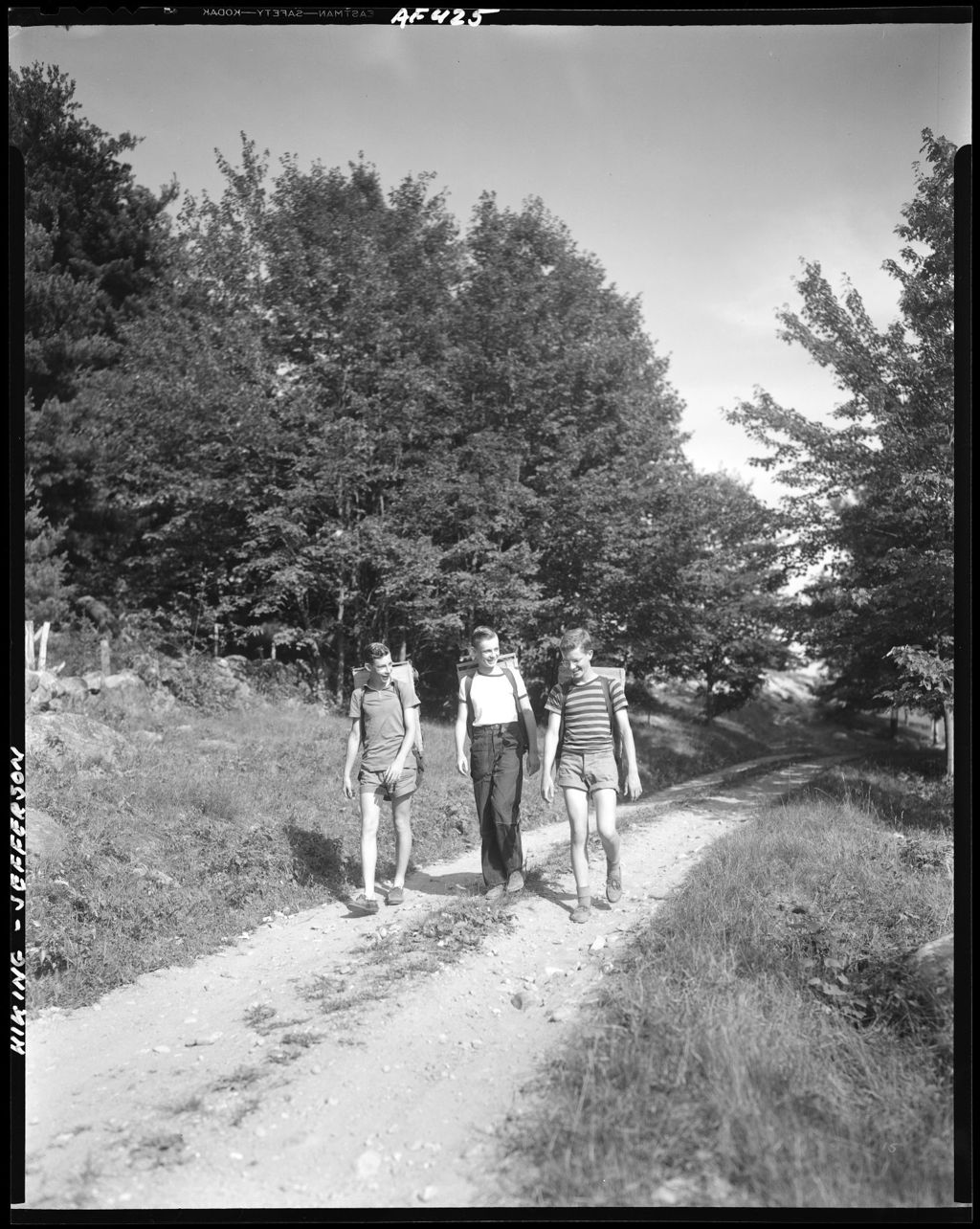 Miniature of Three Boys With Backpacks Walking Along A Trail In Jefferson