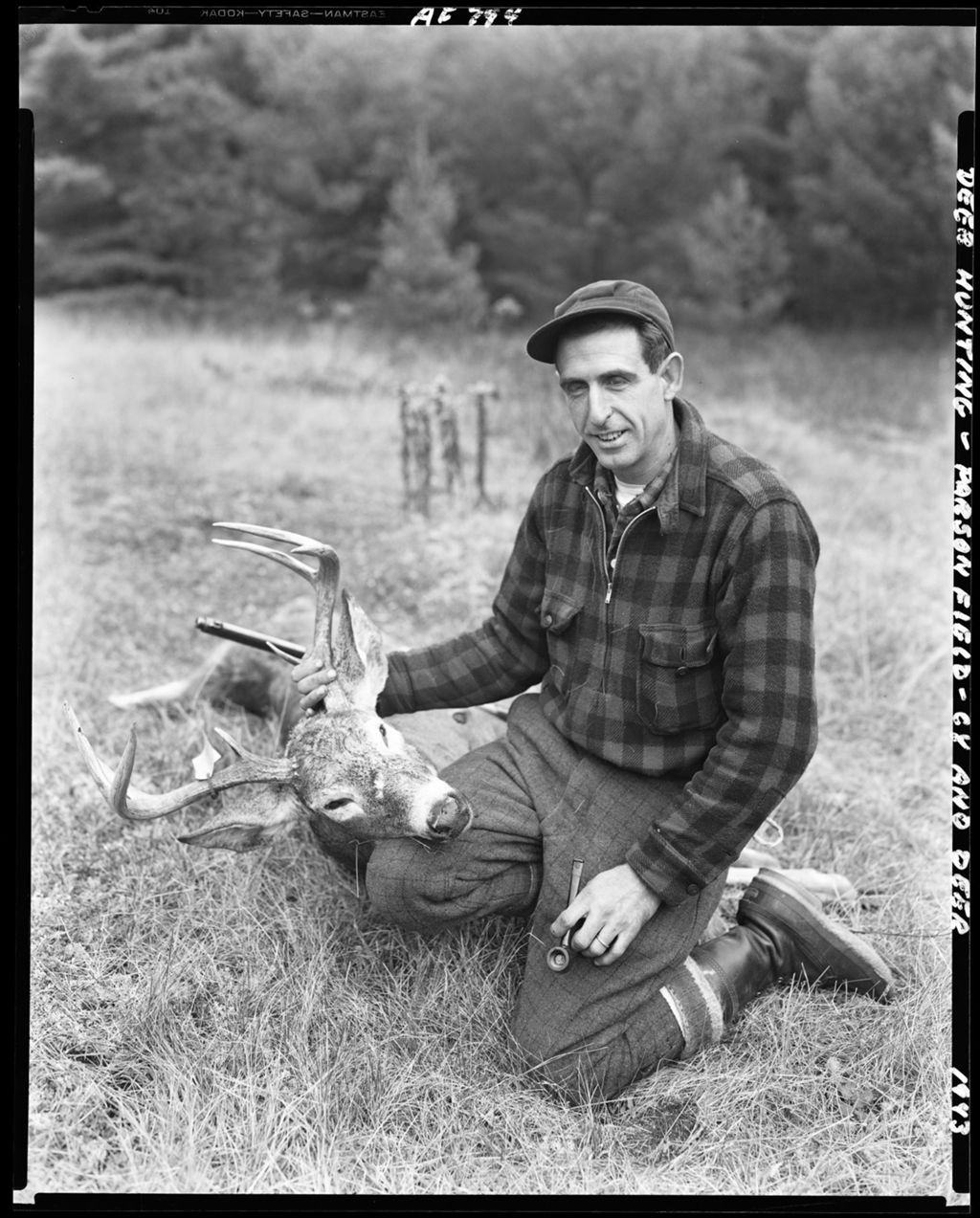 Miniature of Hunter Kneeling Holding Up The Head Of An Eight Point Buck He Shot--Parsonsfield
