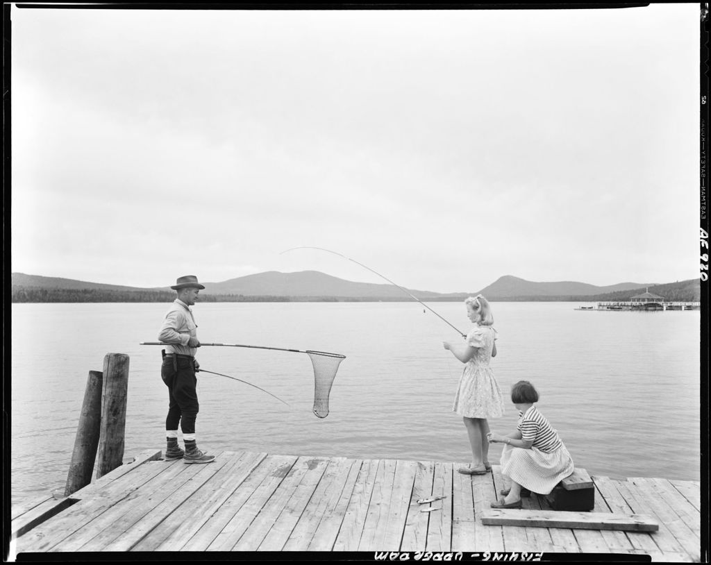 Miniature of Man On Dock Netting Fish For Lady While Another Looks On At Upper Dam