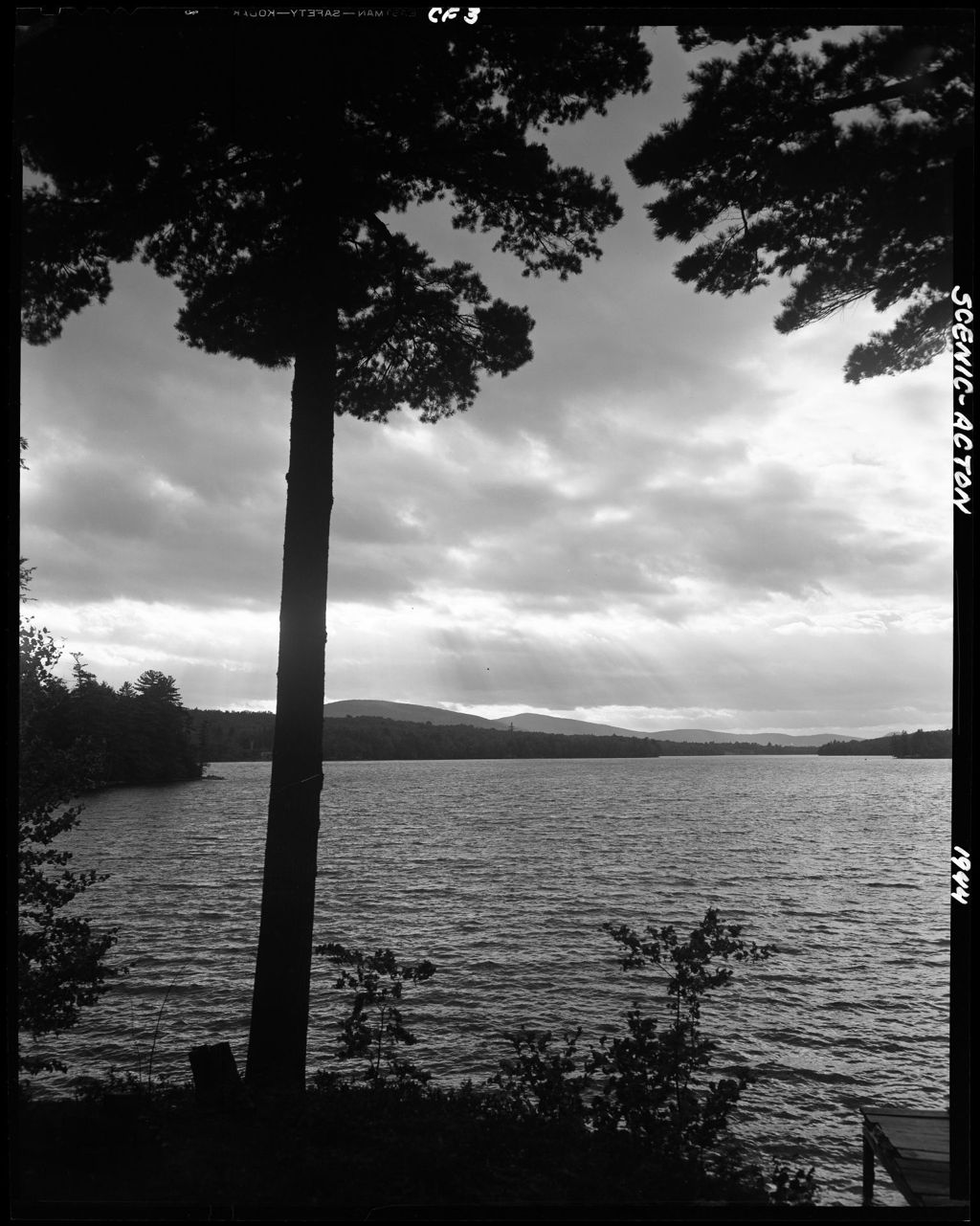 Miniature of Sunlight Streaming Through Clouds Over A Lake In Acton, Mountains In Distance