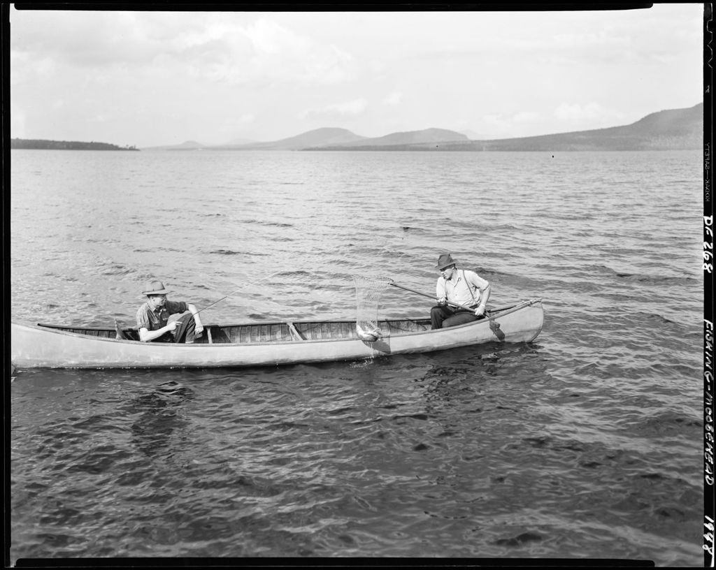 Miniature of Two Men Fishing, One Netting A Fish For The Other At Moosehead