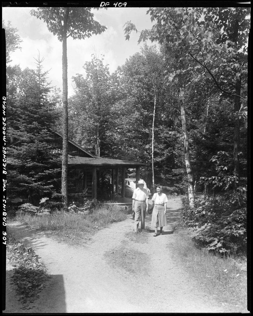 Miniature of Couple Walking On A Road Near A Camp At Moosehead