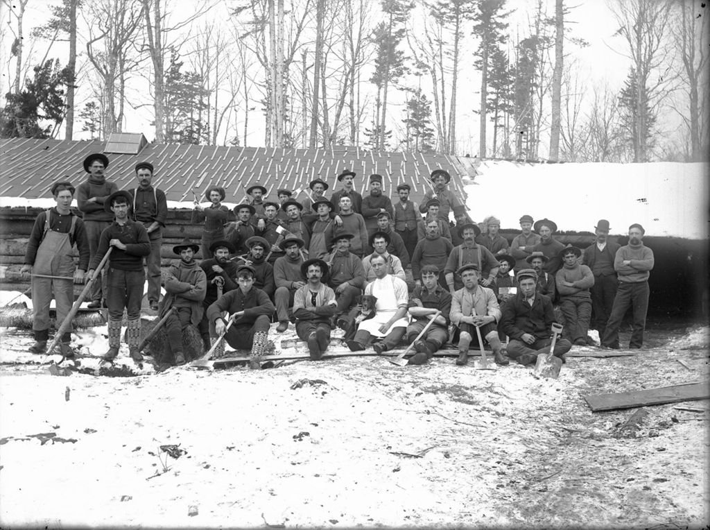 Miniature of Large group of men gathered at a logging camp in winter
