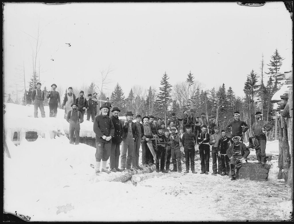Miniature of Snow covered winter scene of many men at a logging camp
