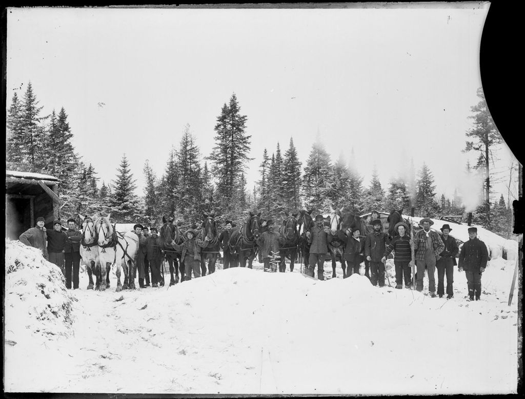Miniature of Snow covered winter scene of men with horse teams at a logging camp