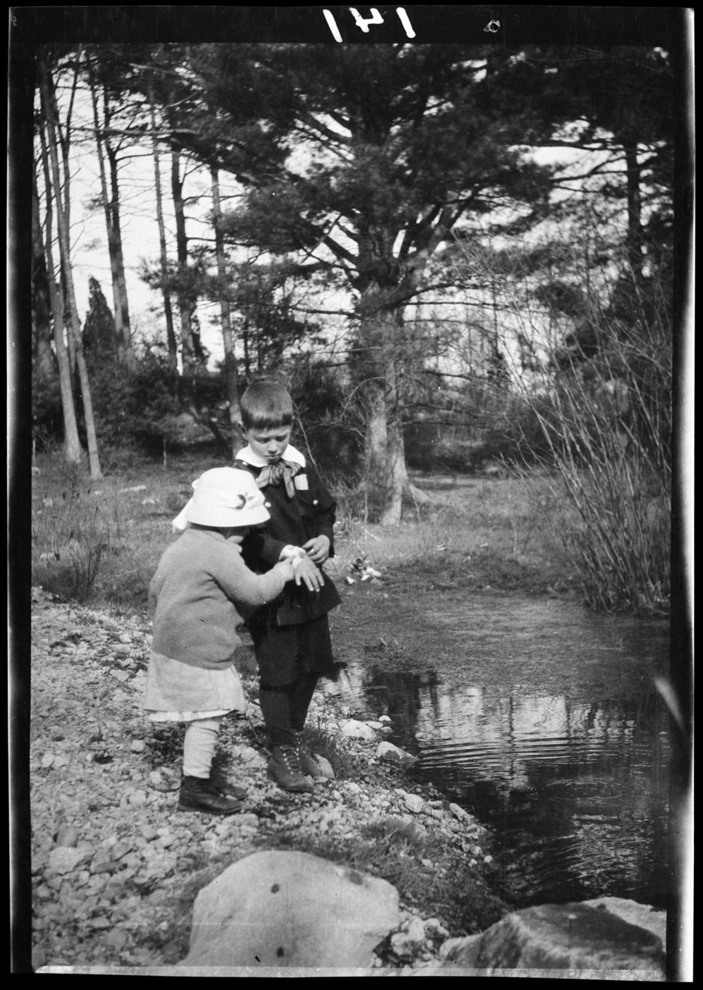 Miniature of Tots- Don And Barb Stand On Bank Of Stream