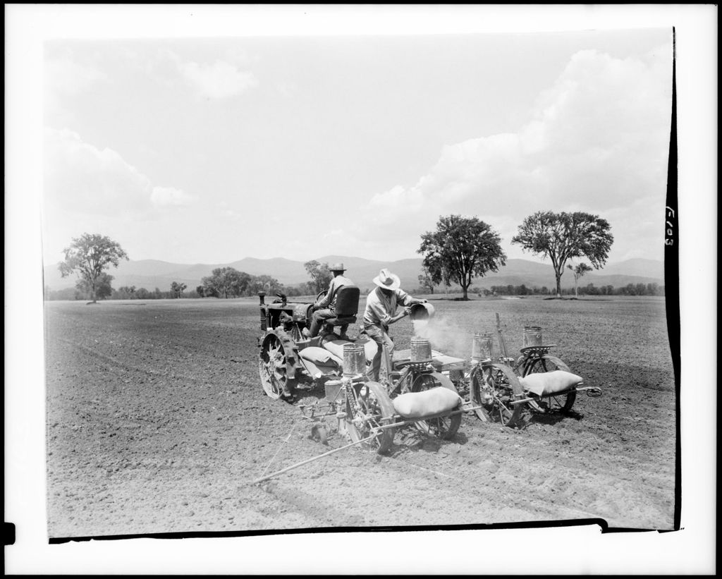 Miniature of Two Men Spreading Fertilizer With Tractors