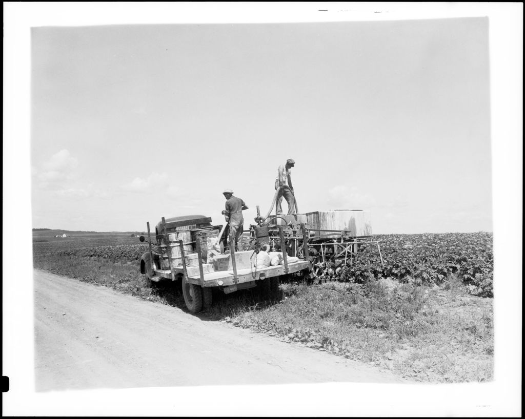 Miniature of Workers Filling Spray Tanks With Pesticides