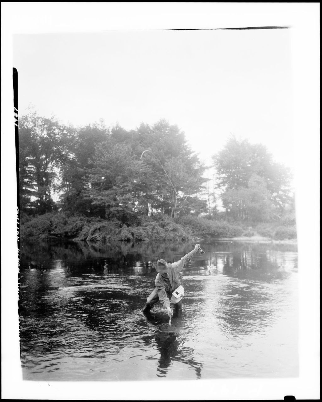 Miniature of Man Reeling In A Fish