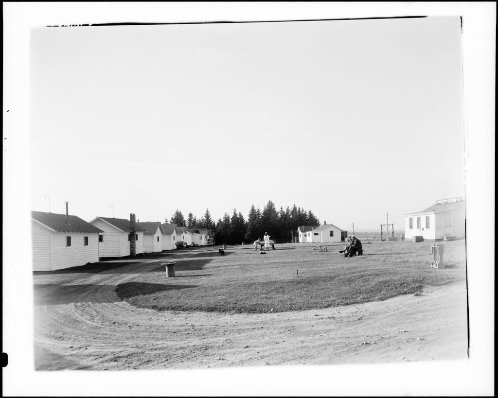 Miniature of A Group Of People In Front Of Camps