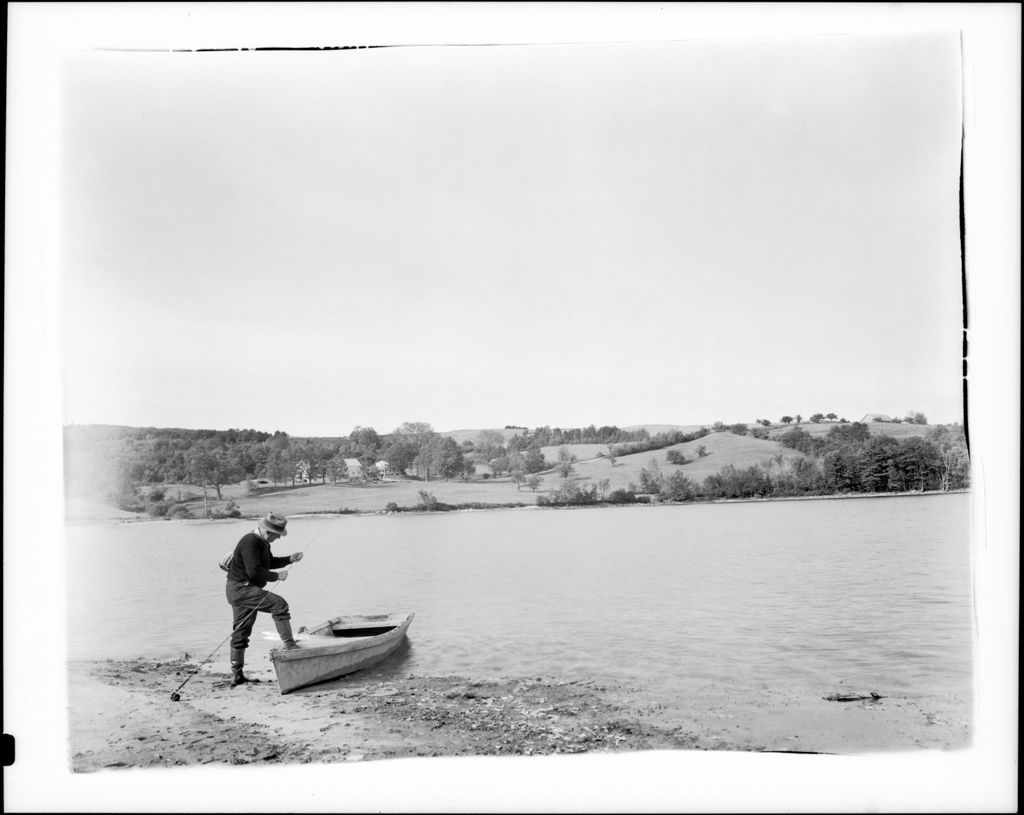 Miniature of Man With Boat Pulled Up On Shore