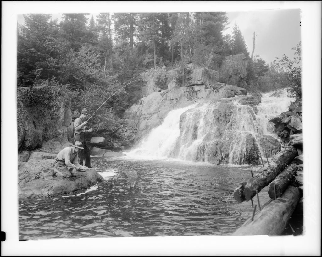 Miniature of Two Men Fly-Fishing Near Falls, One Netting Others Catch