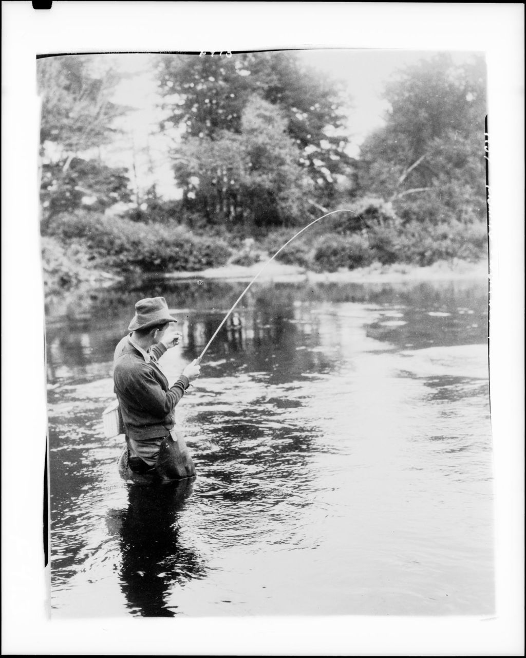 Miniature of Man In Boat Feeling In A Fish