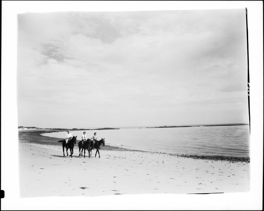 Miniature of Three People Riding Horses On The Beach