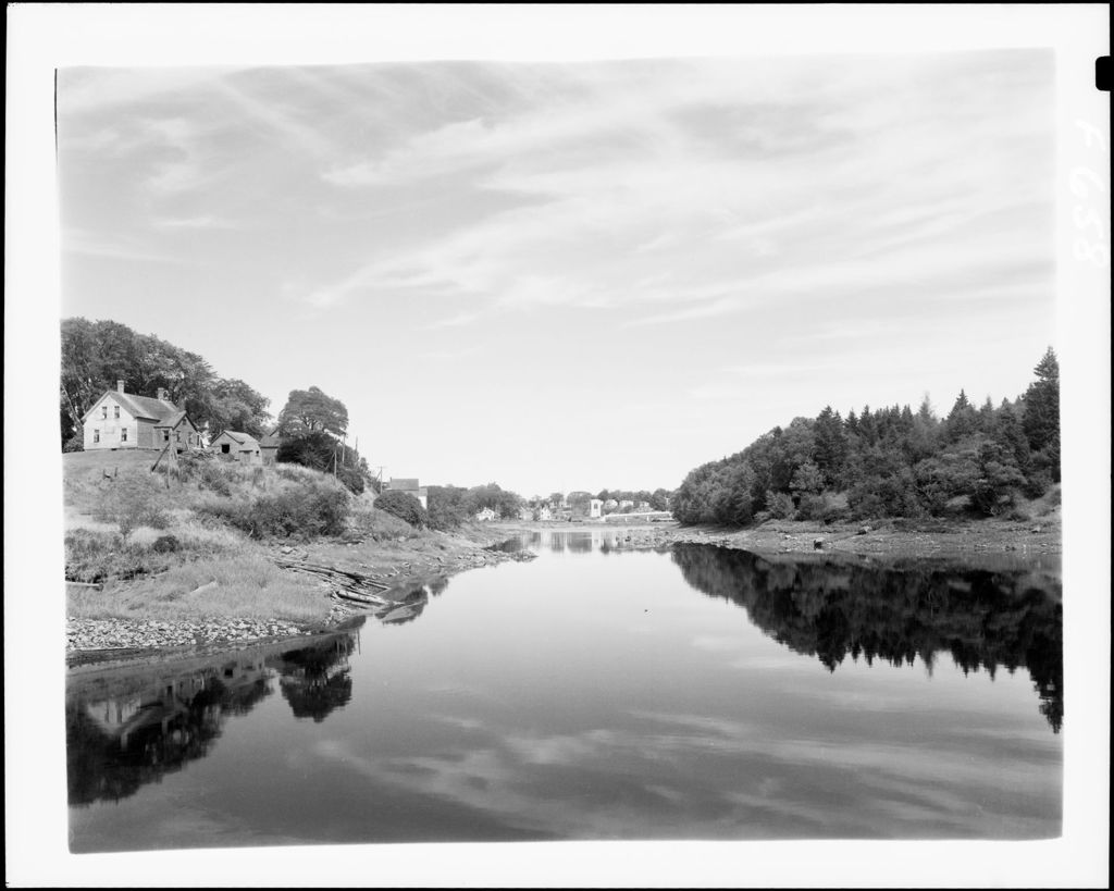 Miniature of Shot From Middle Of River With High Bank On Left With Houses On It