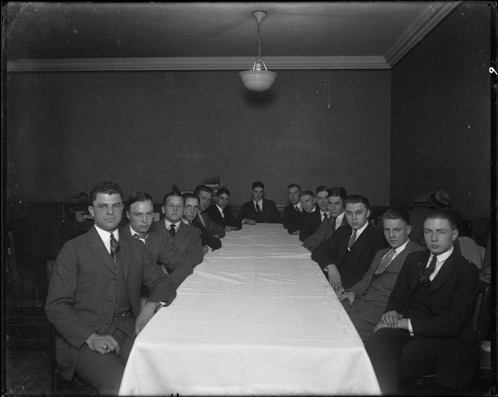 Miniature of Group Of Men Seated At A Long Table (At A College) Nj