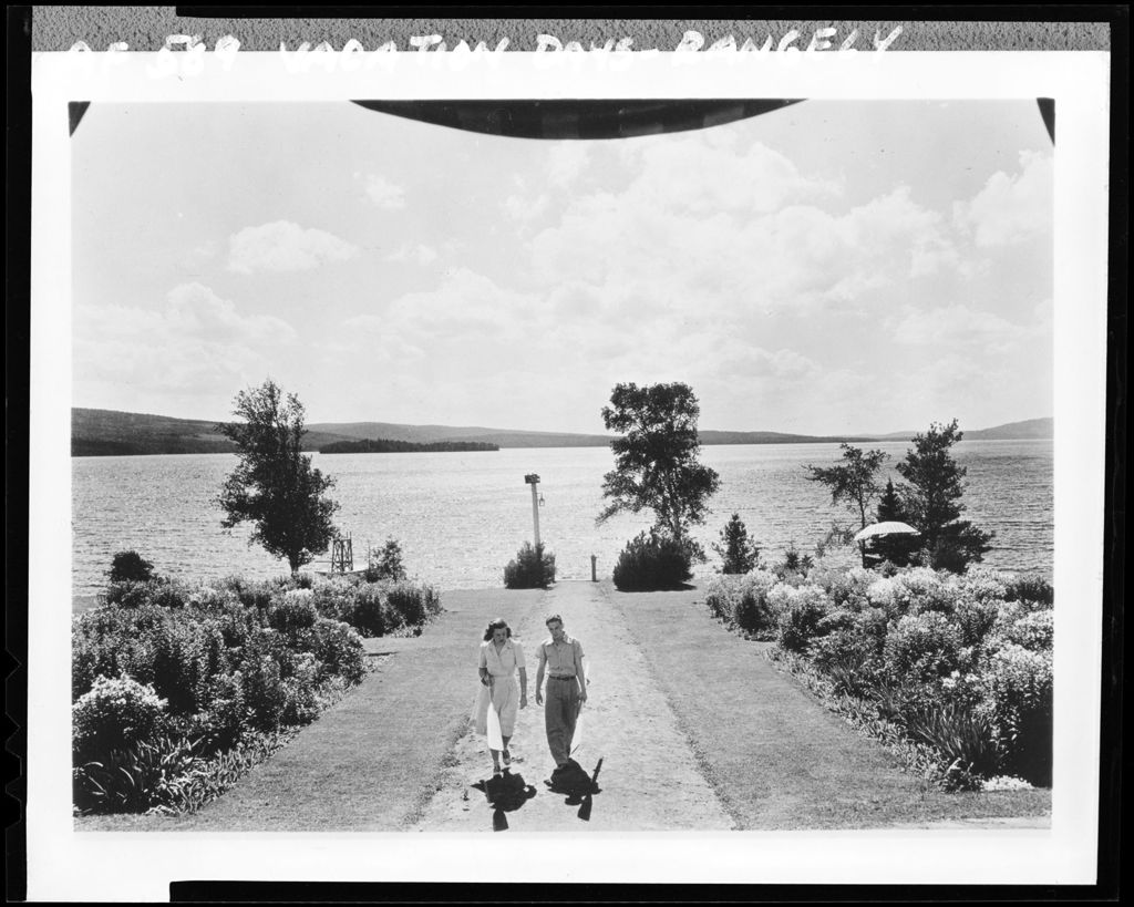 Miniature of Young Couple Walking Up Wide Path From Lake Toward Hotel In Rangeley