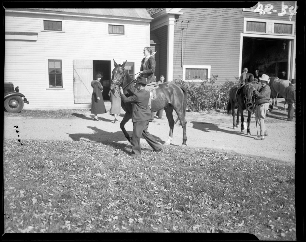 Miniature of People And Horses Near A Stable Getting Ready To Hit The Trail