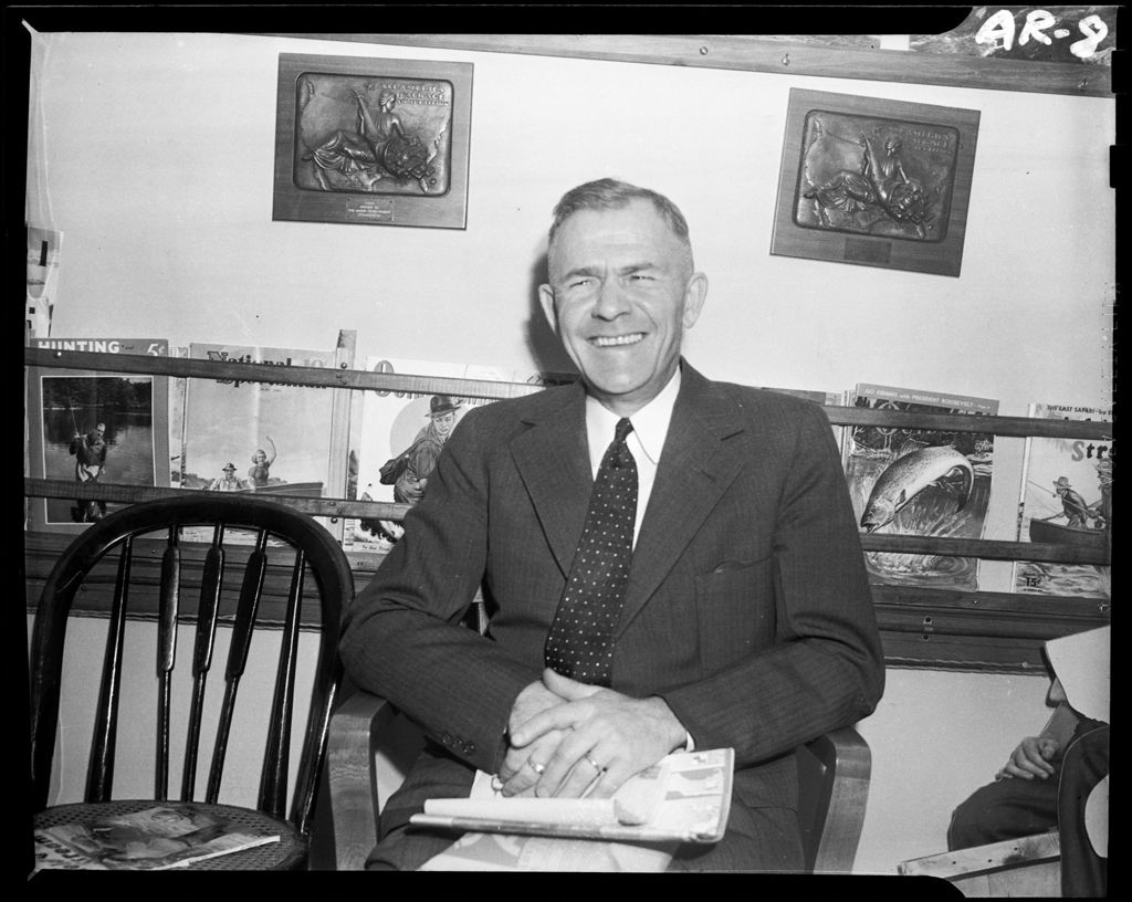 Miniature of Harold Sitting In A Chair In An Office