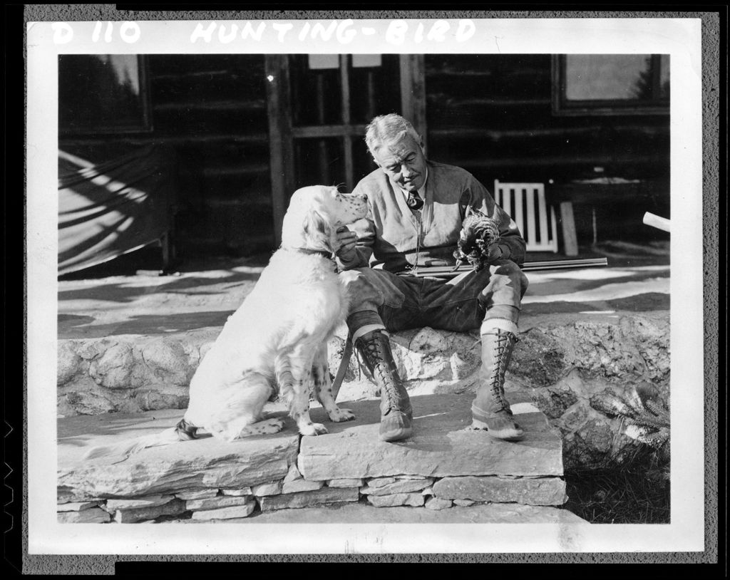 Miniature of Man Sitting On Porch After Day Of Partridge Hunting, Dog Sitting Beside Him