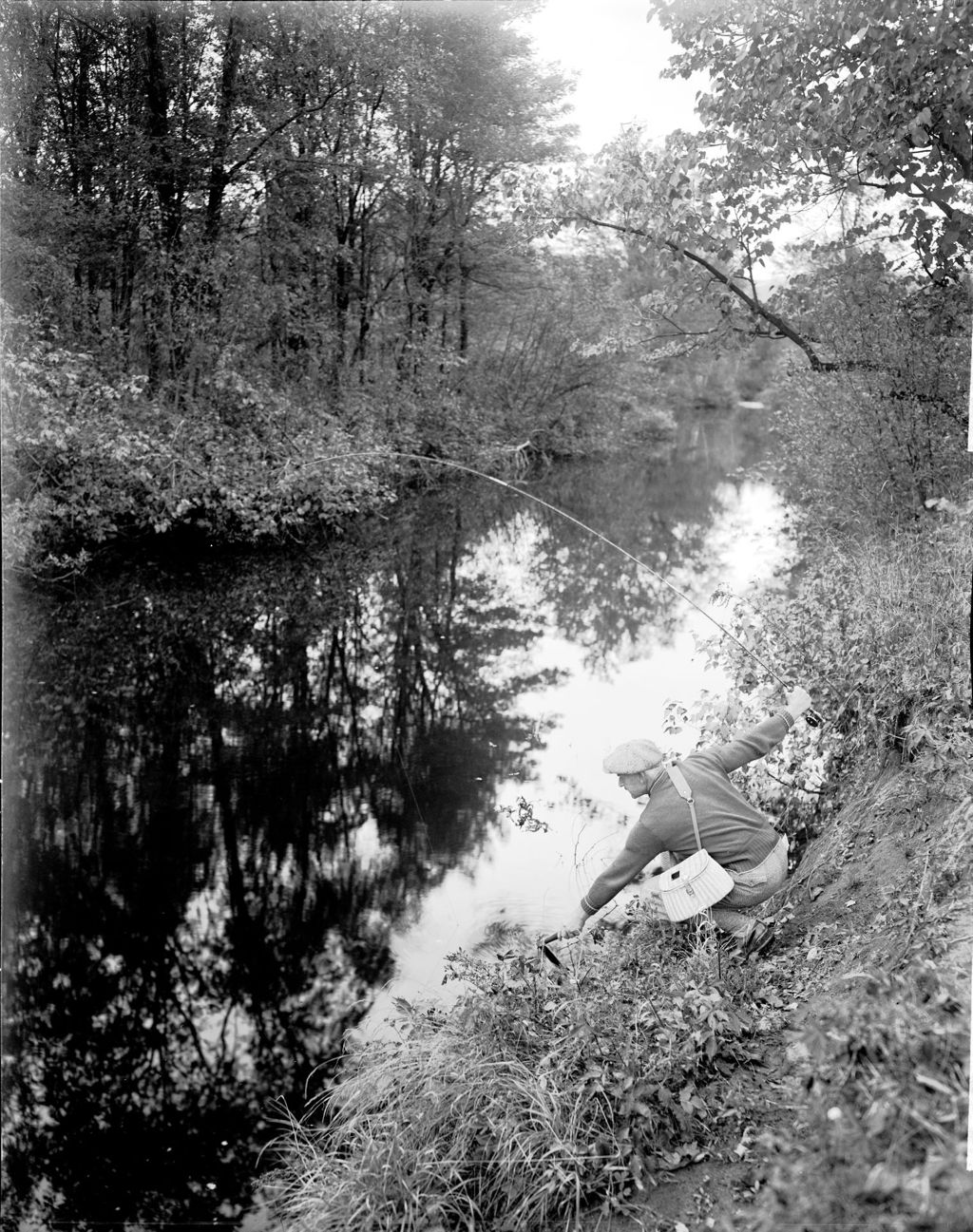 Miniature of Man Netting Fish From Stream Bank In Lovell