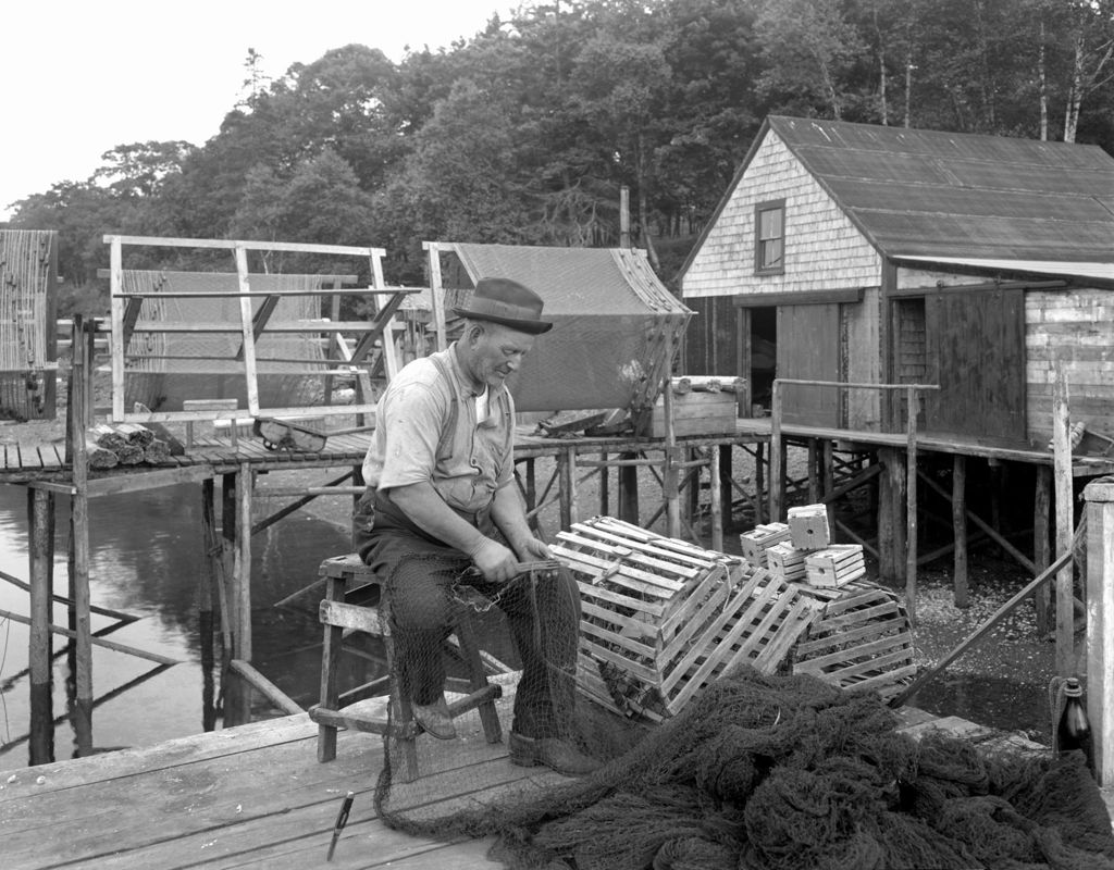 Miniature of Fisherman Sitting On Dock Repairing Fish Net At New Harbor