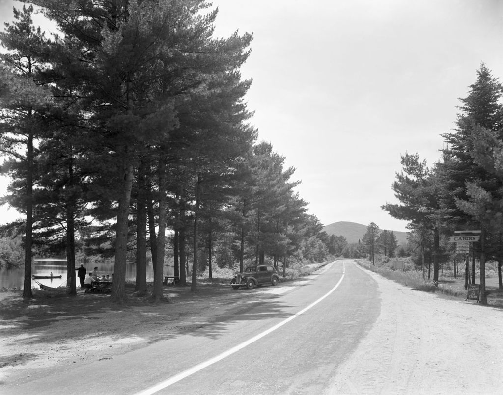 Miniature of People Picnicking At A Roadside Picnic Area