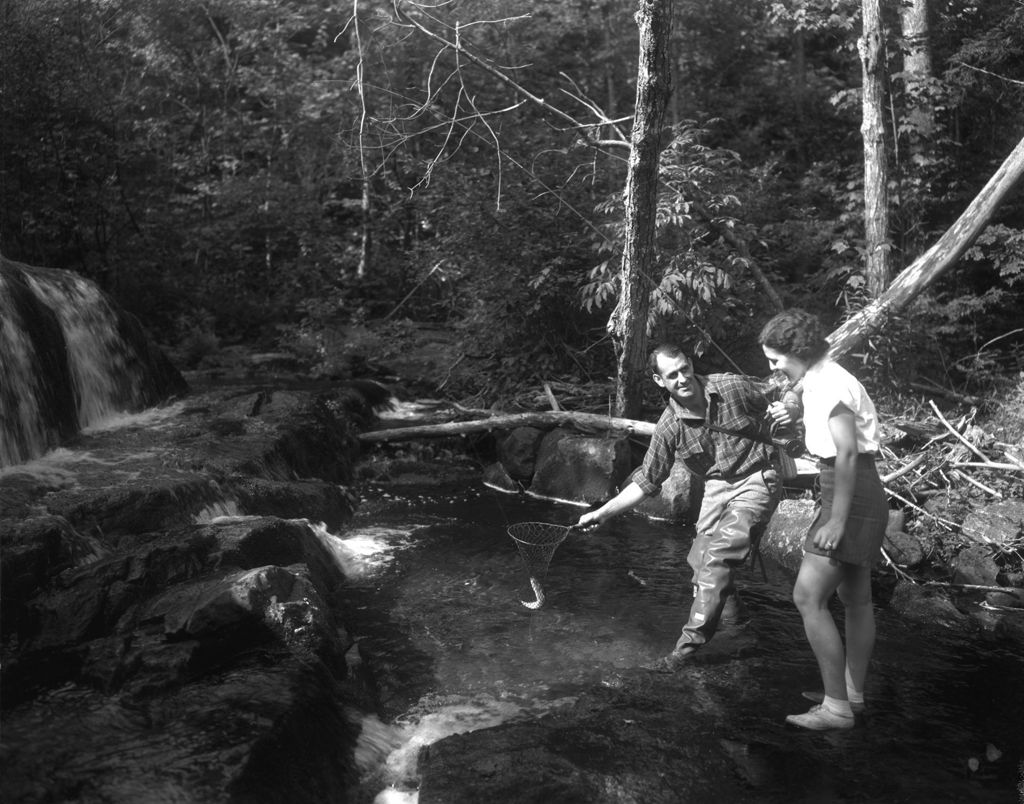 Miniature of Man And Woman Stream Fishing, He Netting Fish For Her On West Branch