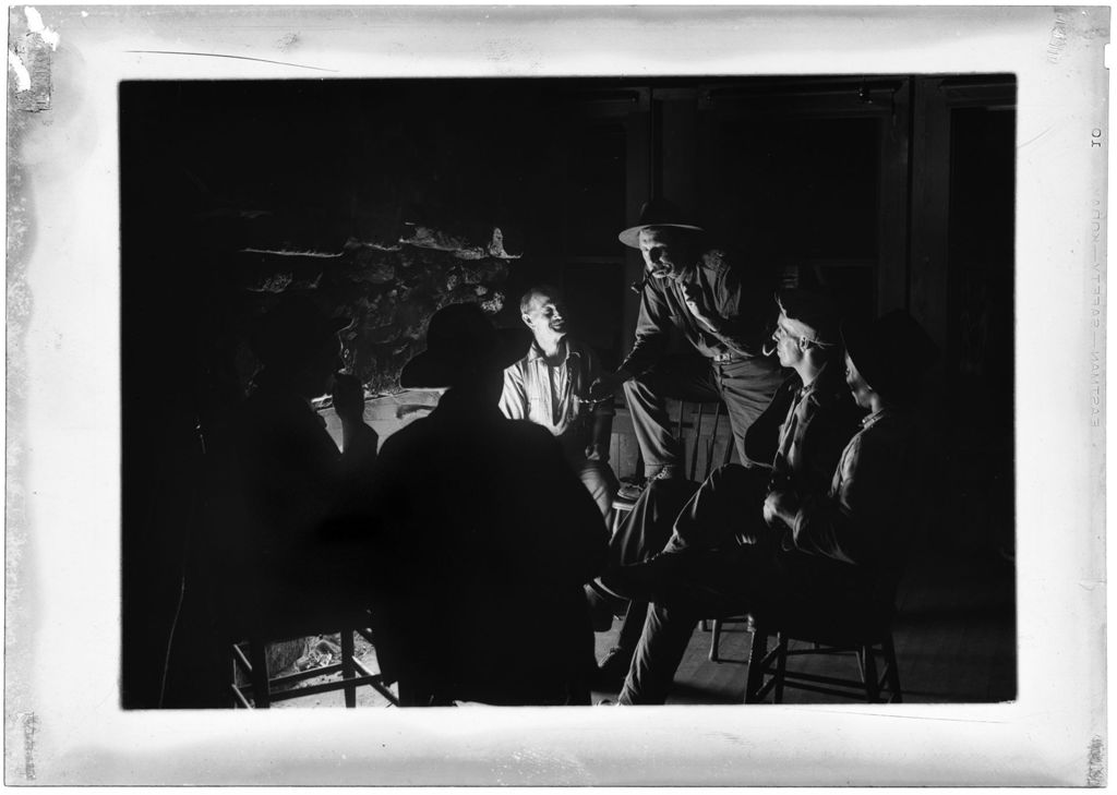 Miniature of Men Sitting Around Fireplace Smoking Pipes And Telling Tales