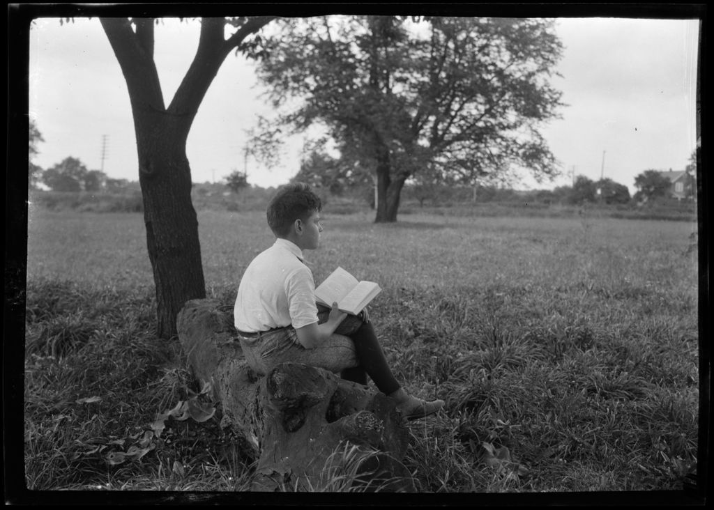 Miniature of Don French Sitting On Log Under Apple Tree, Reading