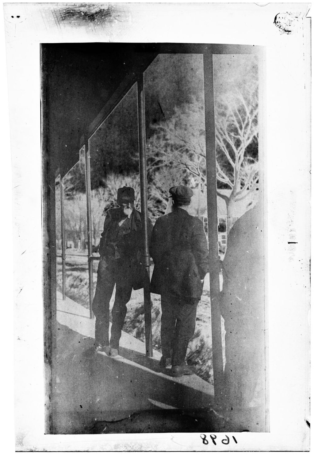 Miniature of Two Men Talking On A Porch