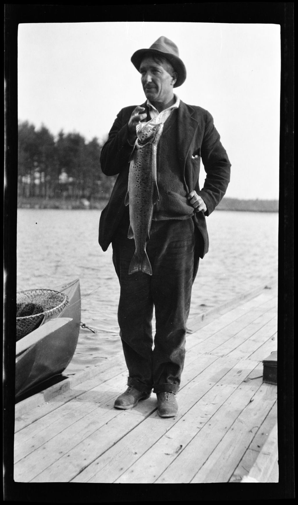 Miniature of Man Standing On A Dock Holding A Nice Salmon