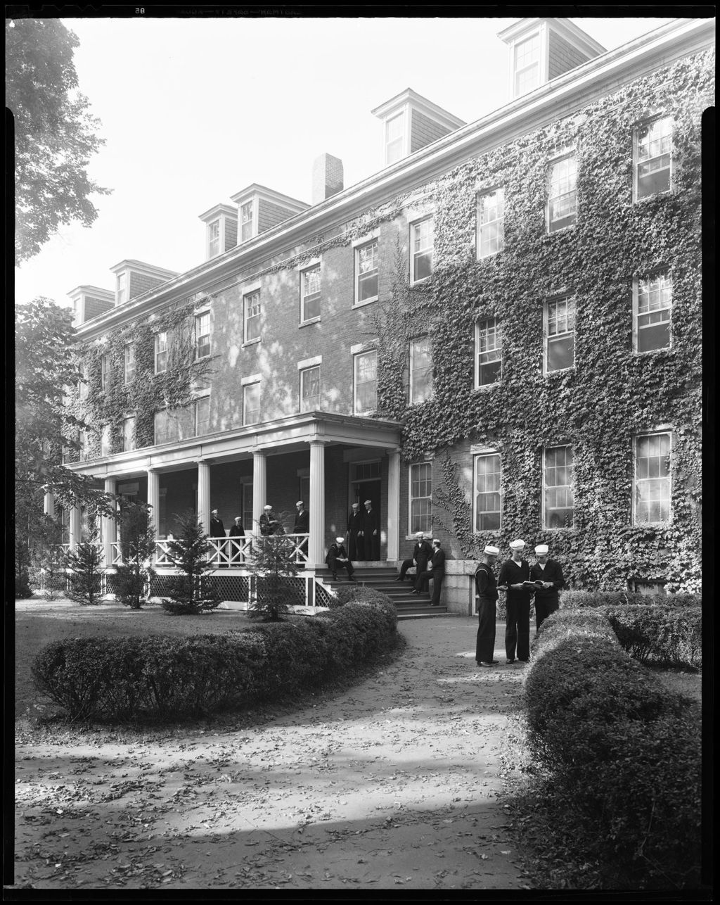 Miniature of Large Ivy Covered Building, With Many Students (Navy Prep) Stand On Porch And Sidewalk At Bates College