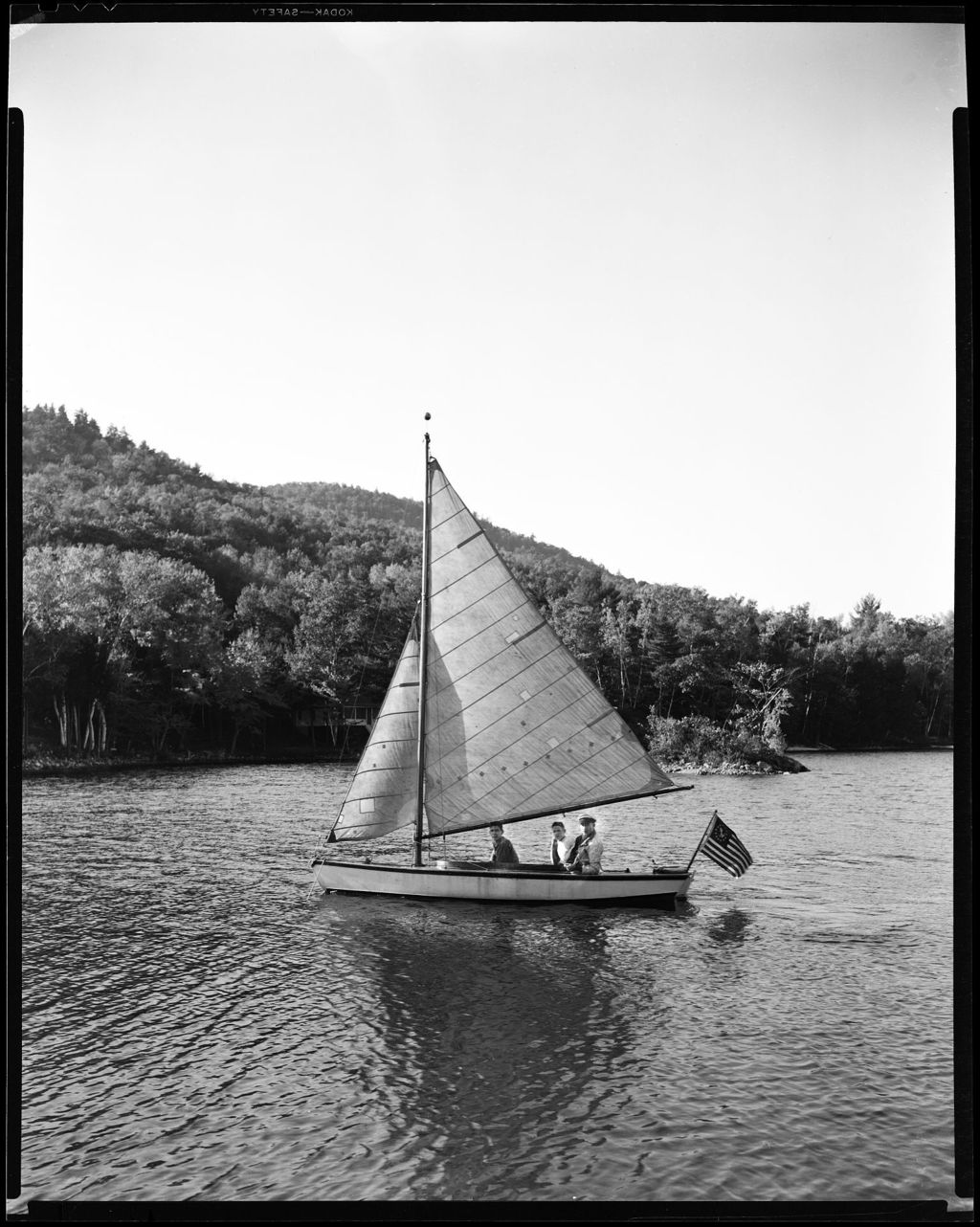 Miniature of Three In A Sailboat Up Close, Mountains In Background-- Porter