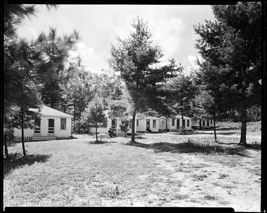 Miniature of Row Of Cabins With People Sitting Outside, Goodwin's Cabins In North Sebago