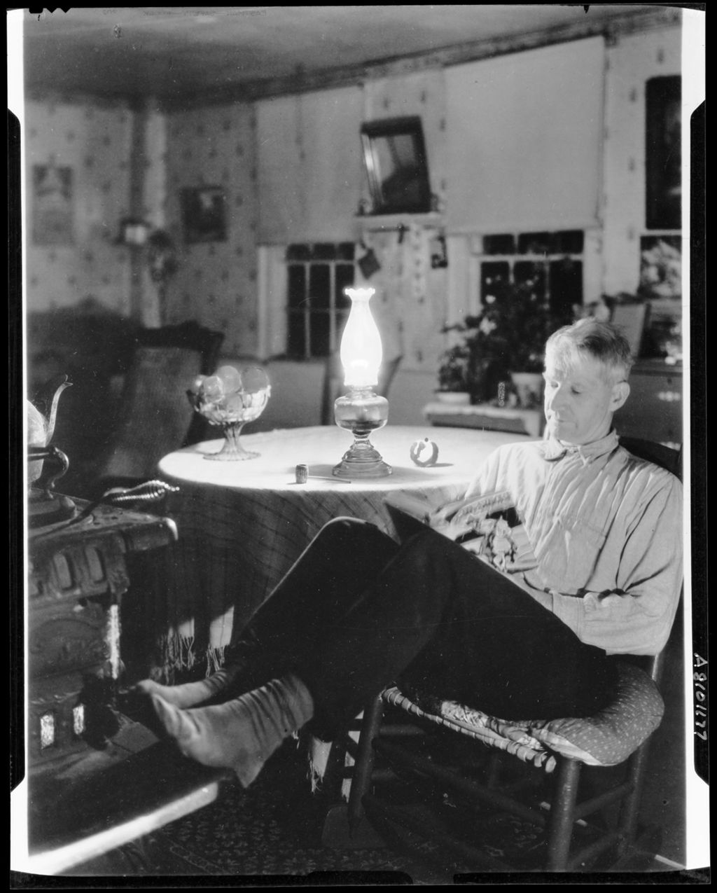 Miniature of Man Reading By Kerosene Light In Kezar Falls