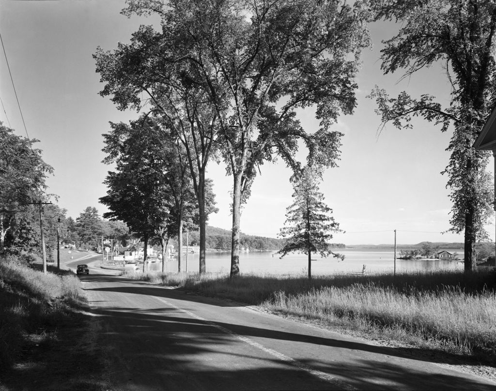 Miniature of Shot Down A Road With Lake On Right And Trees In Center